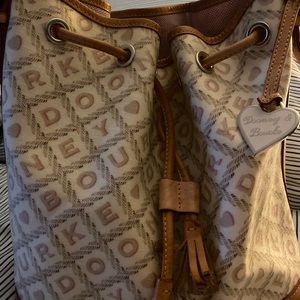 Dooney and Bourke draw string barrel style bag.